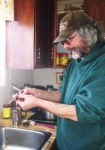 Wayne guts the whitefish he caught the day before and examines the stomach contents to see what the fish have been eating