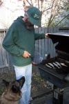May 17, 2004 - If Charlie can't run up and down the rose bed, at least he can have fish.  The first fish barbeque of the season.