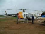 Biologist Dave Latham prepares to travel by helicopter to check on the many sites in his research area.  It covers 20,000 square kilometers in northeastern Alberta.
