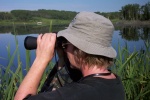 August 10, 2004 - There's lots to see from the road beside the lake at Ghostpine.  The white speck in the background above my spyglasses is actually an island covered with 40 or more pelicans.