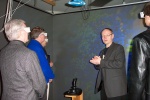 Wearing special stereoscopic glasses to "see" the virtual protein molecule projected in  3D