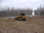 Dozer beginning to level subsoil returned from spoil pile