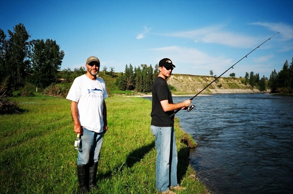 August 19, 2005 - Wayne and his son Aaron try their luck on the Red Deer River.This turned out not to be a good day to be fishing the Red Deer. After all the rain, the water was rising and it appeared water was being let out of the Dickson Dam just upstream. There was a lot of material rushing down the river, logs and such.
