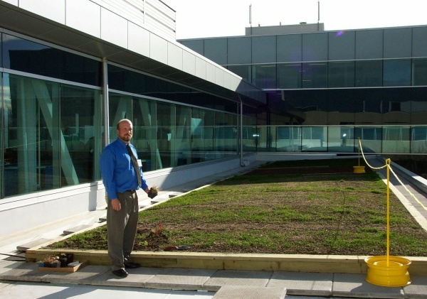 Trevor Sziva stands before the green roof garden on top of the Alastair Ross Technology Centre in Calgary before the plantings are dug in.