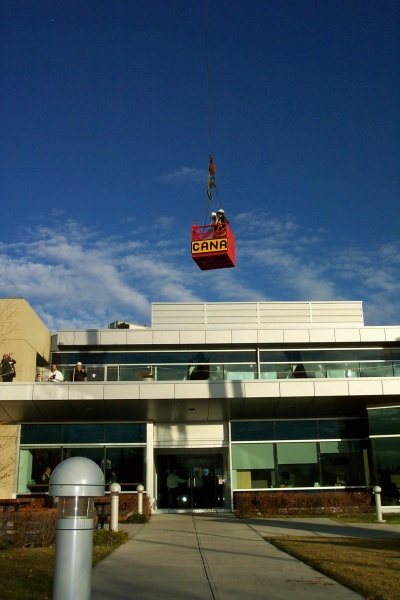 CTI CEO John Masters and Calgary Mayor Bronconier are lifted by crane to officially launch CTI's Green Roof Initiative